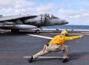 A Sailor Directs an AV-8B Harrier